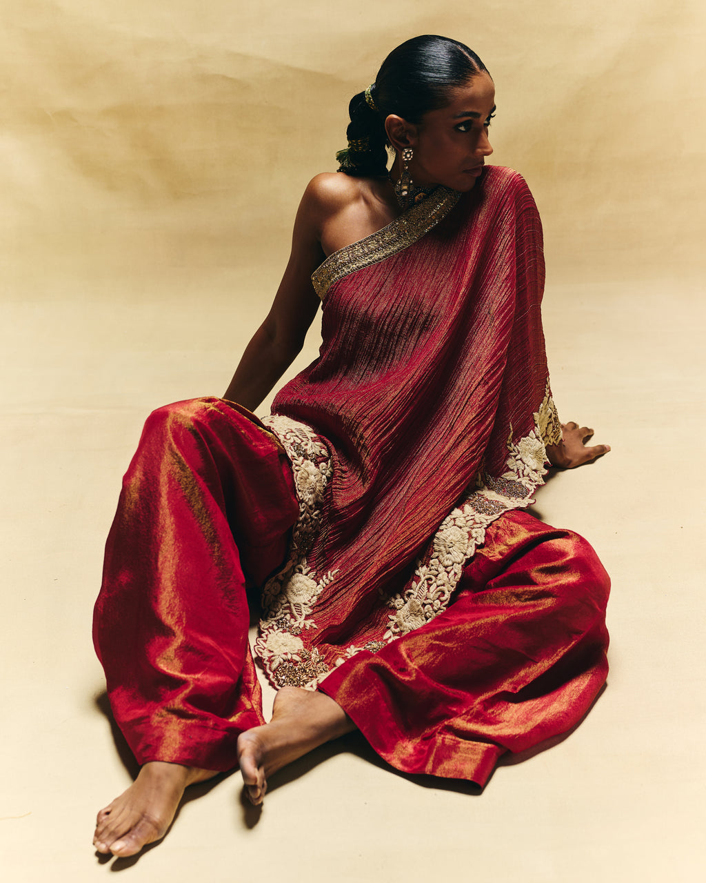 Red one shoulder top with farshi pants