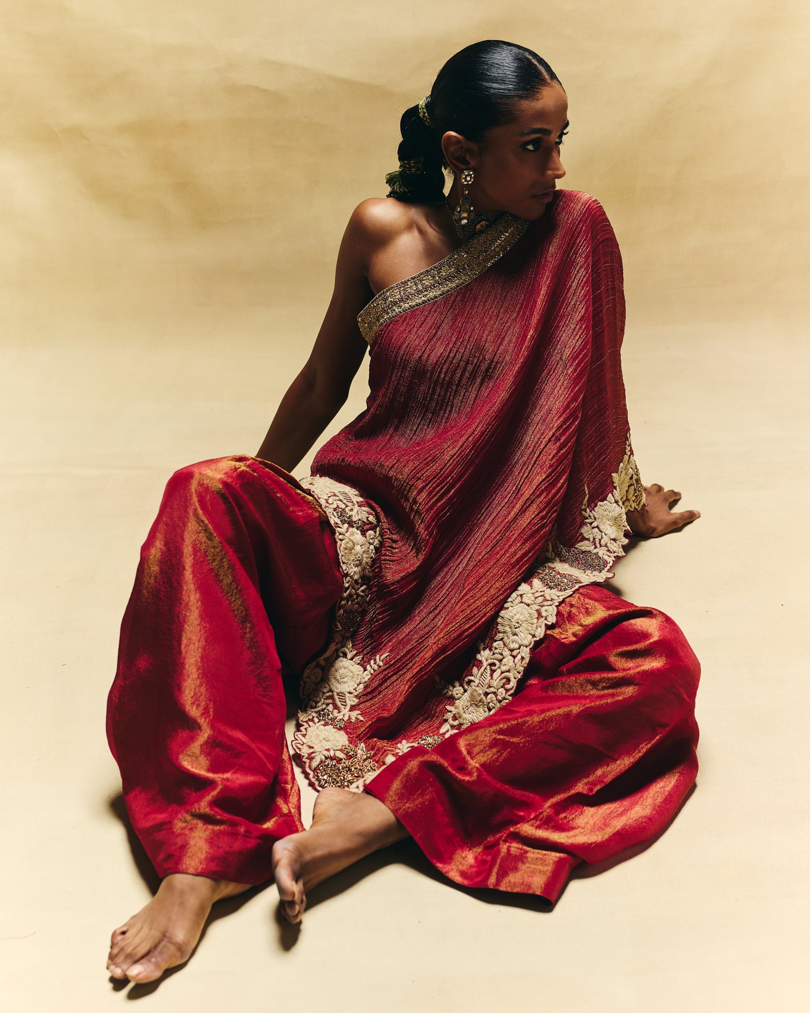 Red one shoulder top with farshi pants