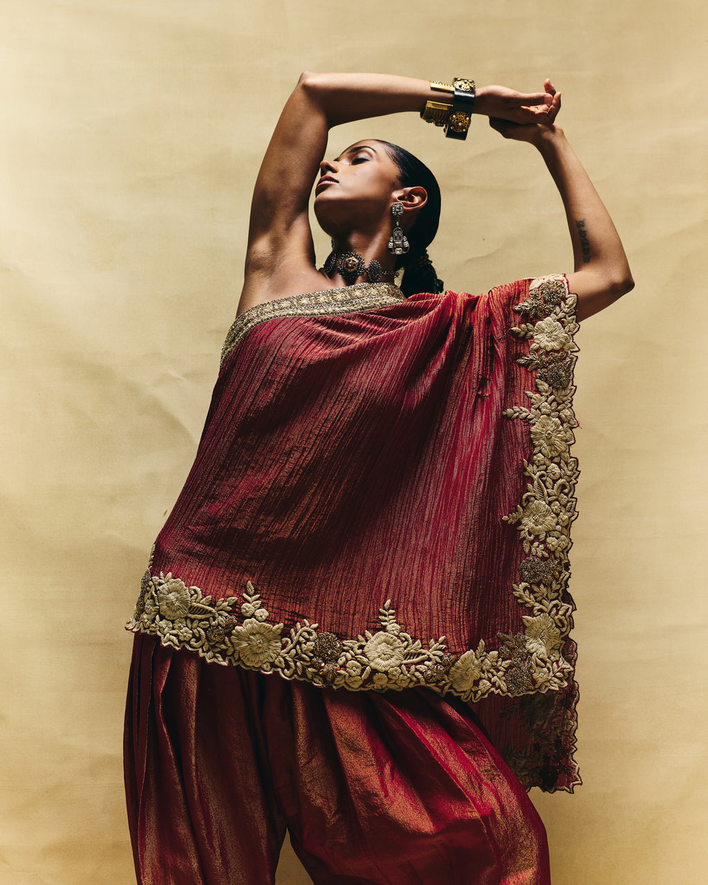 Red one shoulder top with farshi pants